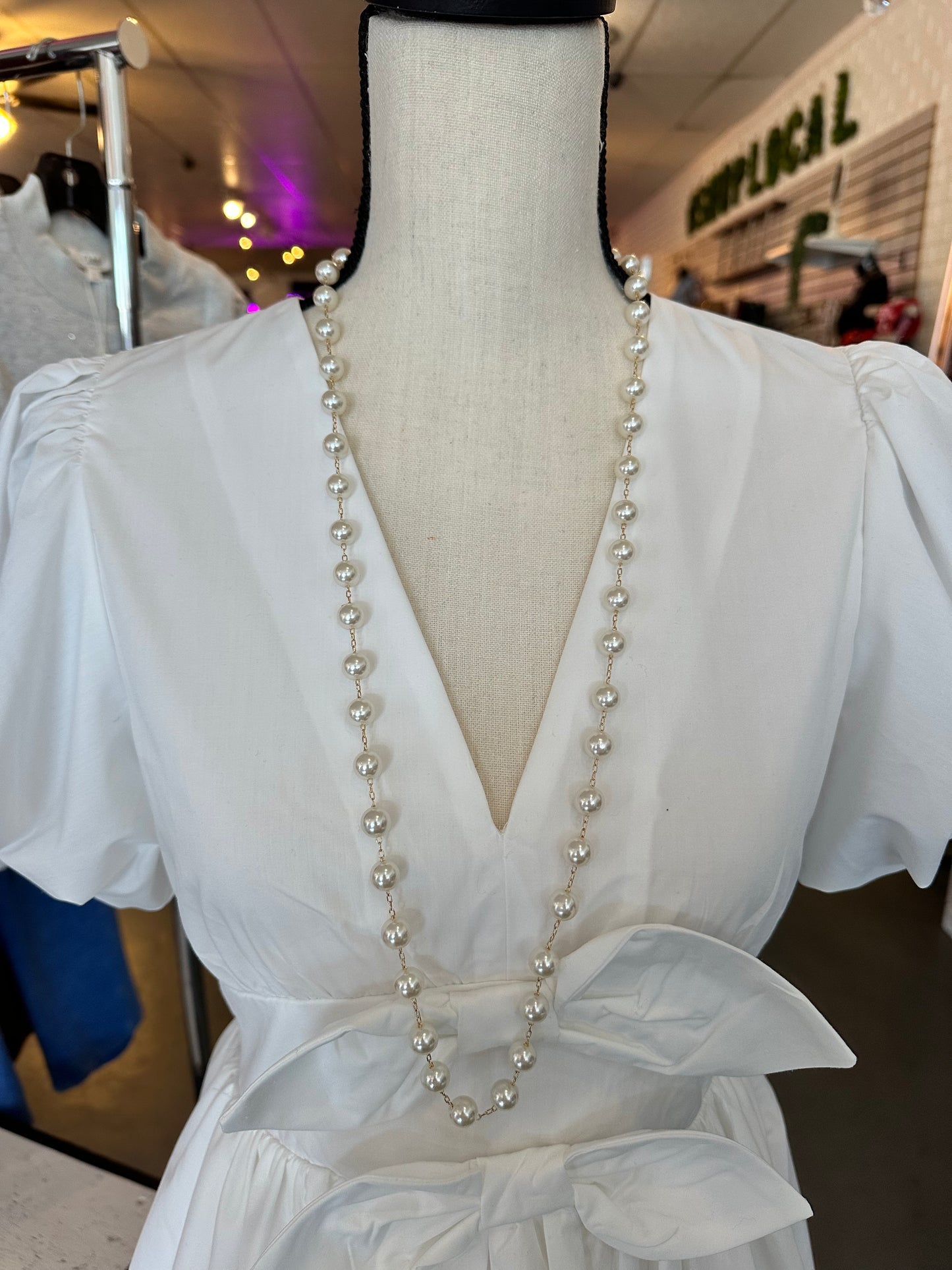 Long pearl and gold necklace