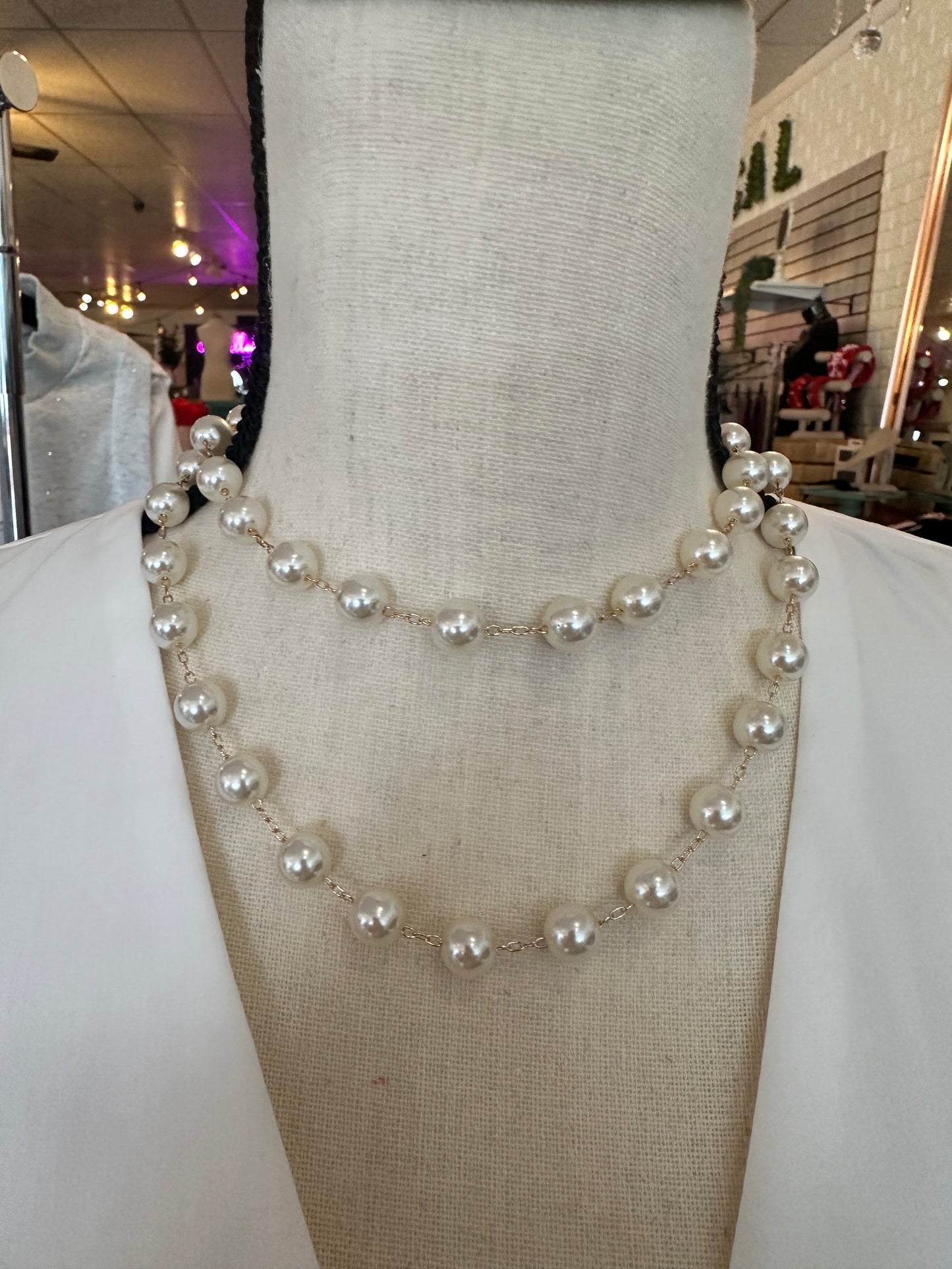 Long pearl and gold necklace