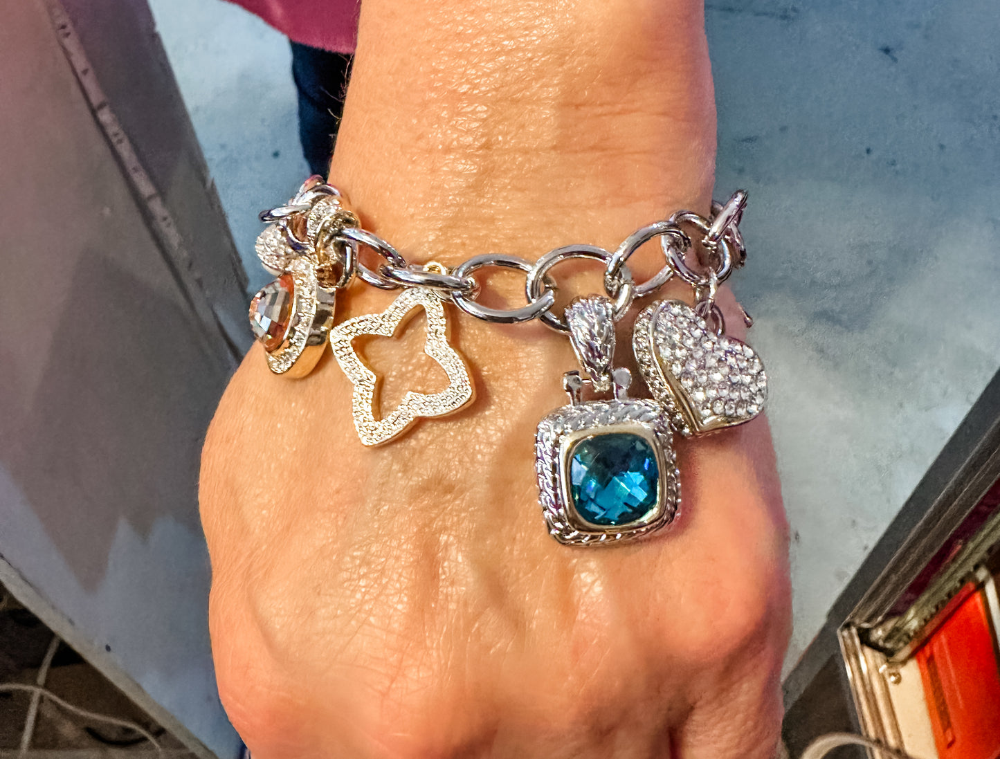 Mixed metal charm bracelet